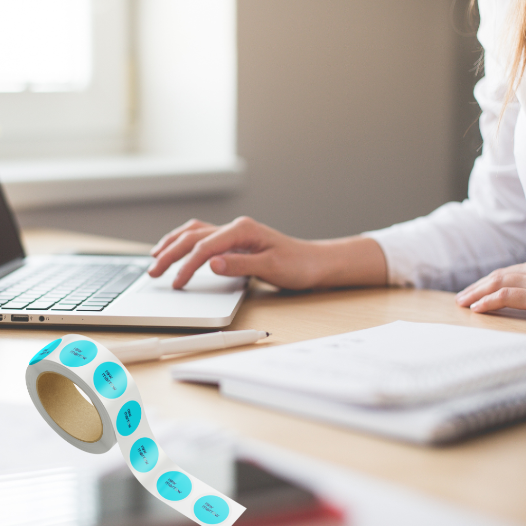 your content is boring pic of woman at desk with product of sticker rolls
